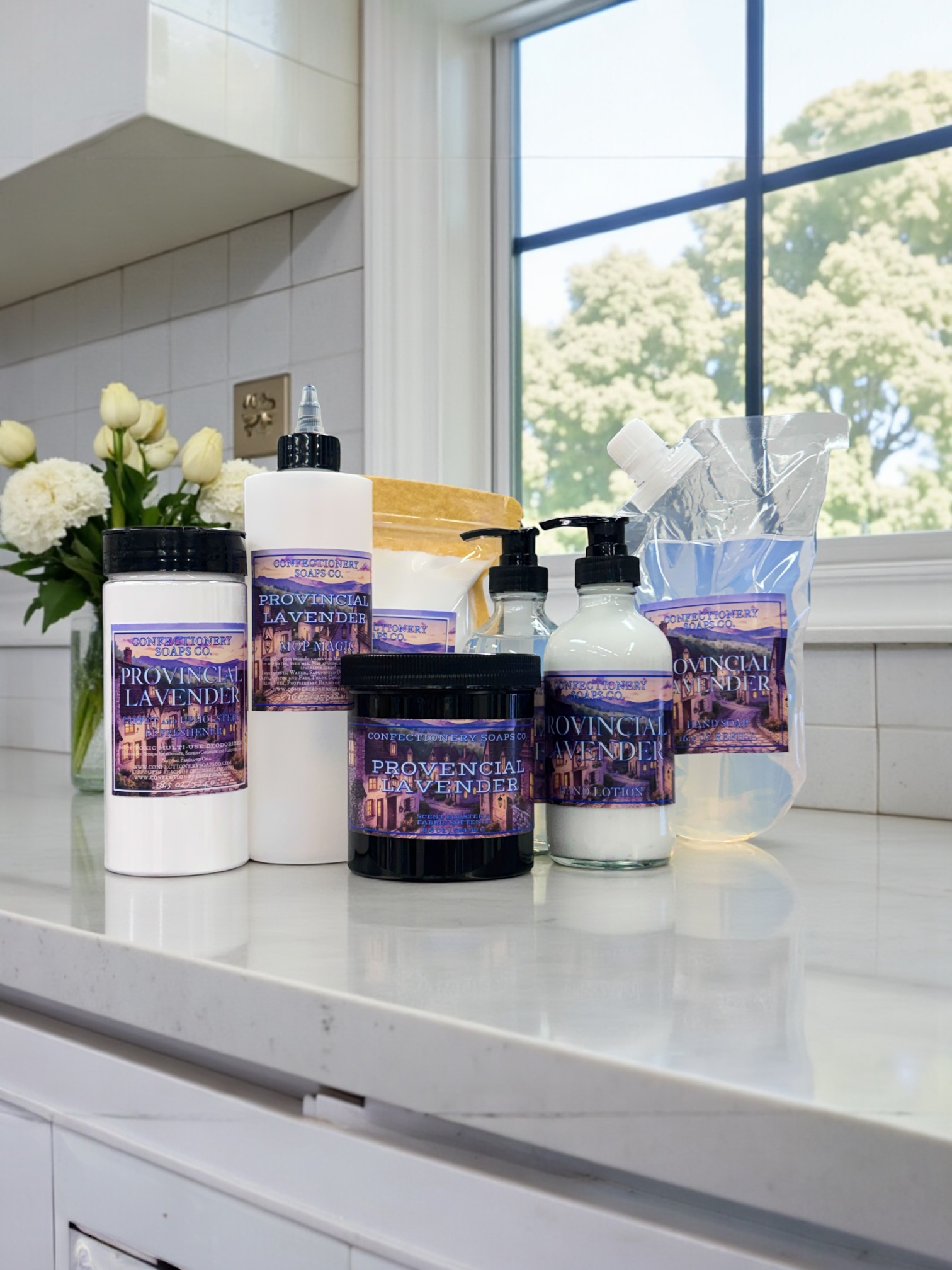 Collection of Provenance Lavender products on a kitchen counter with a window in the background.
